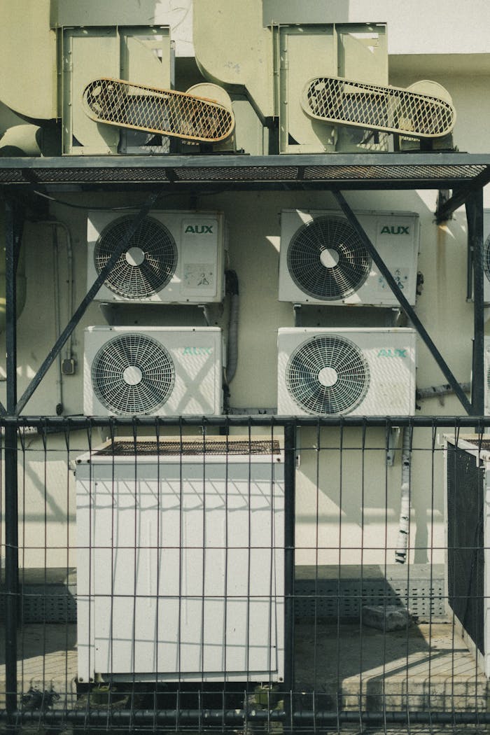 Services-01 Vertical shot of multiple air conditioner units outside a building