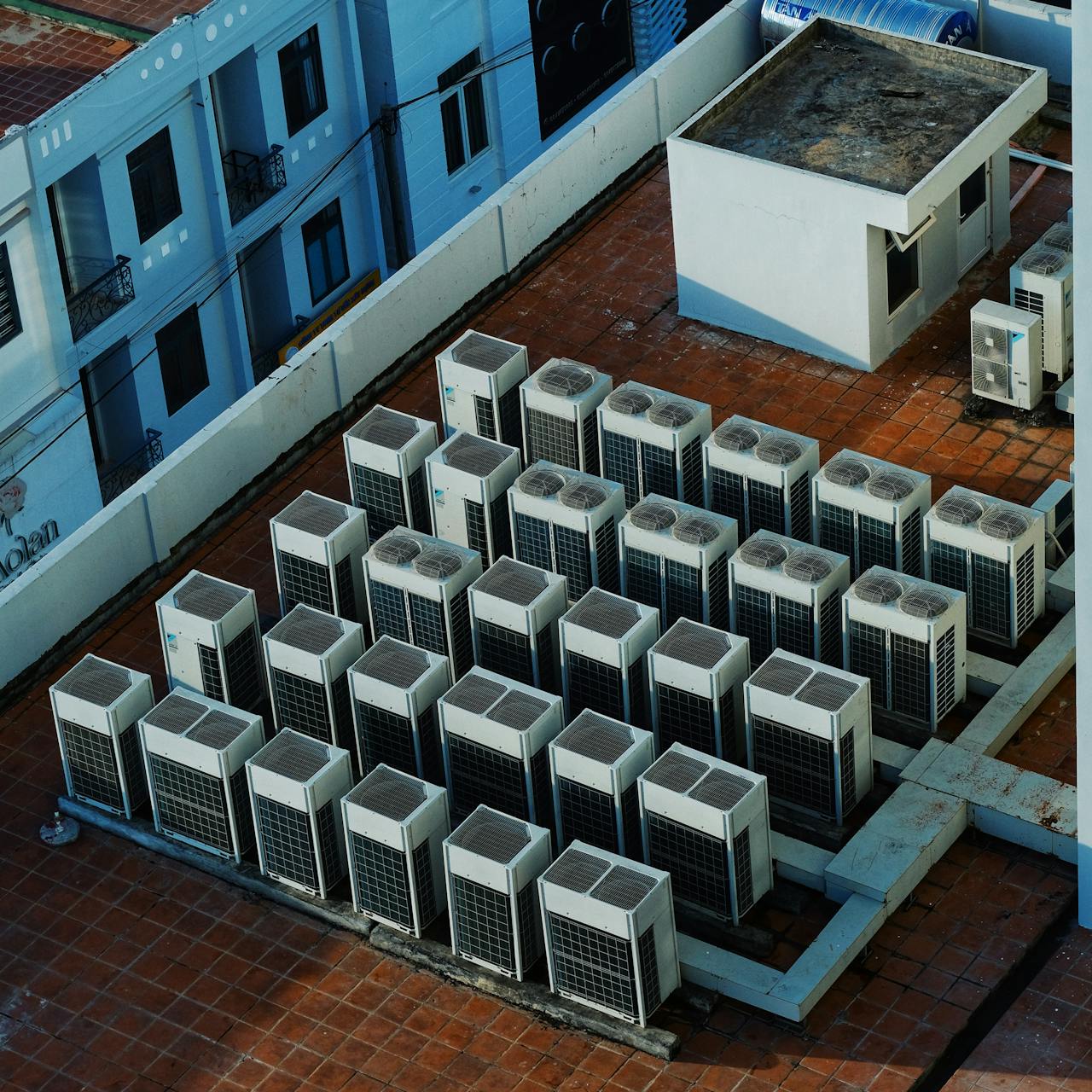 Services-02 High angle view of rooftop HVAC units on a building in Buon Ma Thuot, Vietnam.